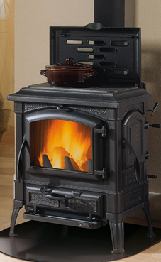 NORDICA-EXTRAFLAME ISETTA CON CERCHI 7 Kw.(estufa de fundición) Estufa totalmente en fundición esmaltada  Placa de hierro fundido alisada  Cristal ceramico que resiste hasta 750° Puerta de carga lateral antracite